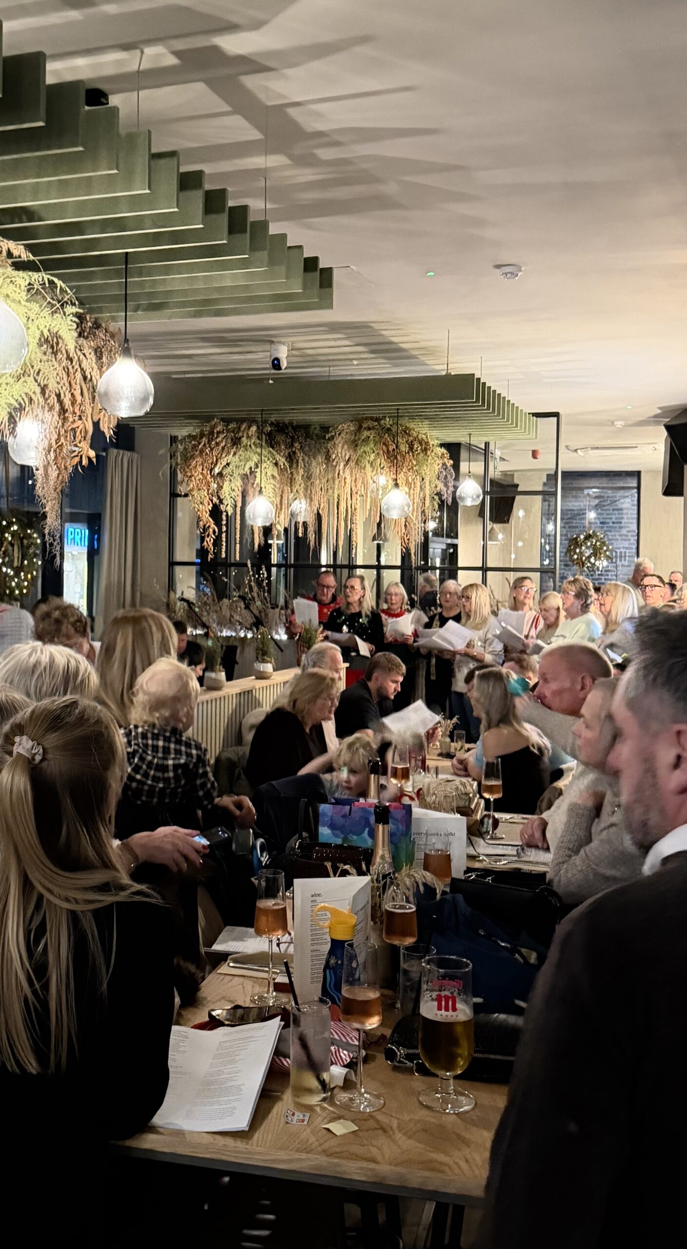 Christmas choir singing to guests at Bottle & Thyme