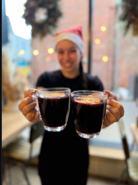 The Bottle & Thyme team serving mulled wine on Christmas Eve