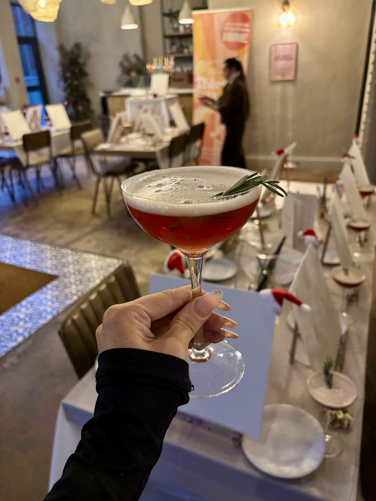 Festive cocktail with easels ready for Sip & Paint at Bottle & Thyme