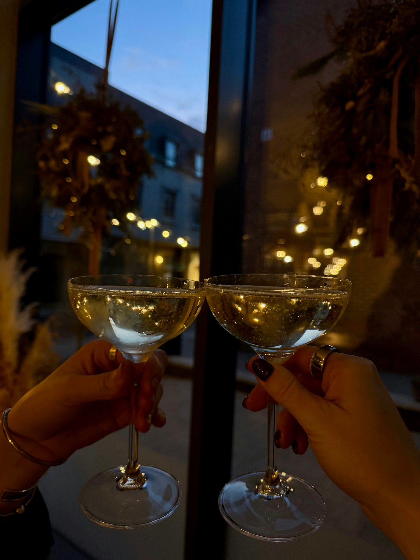 Raising sparkling wine glasses at Bottle & Thyme on New Year’s Eve